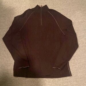 Brown three-quarter zip cashmere sweater.